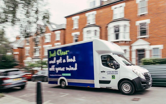 Just Clear logo and branding wrapped on a delivery van.