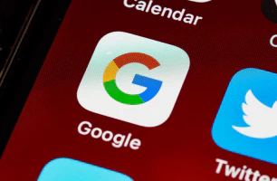 A shot of the iPhone home screen, with the Google app as the center focus.