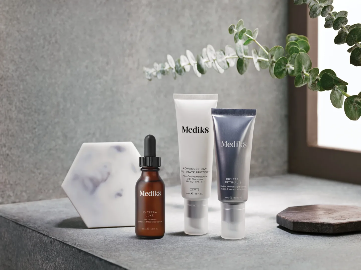 Three Medik8 products, side-by-side center shot.